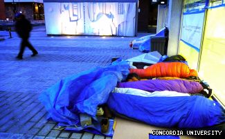 Students snuggle for warmth on de Maisonneuve on the first night of the 5 Days for the Homeless.
